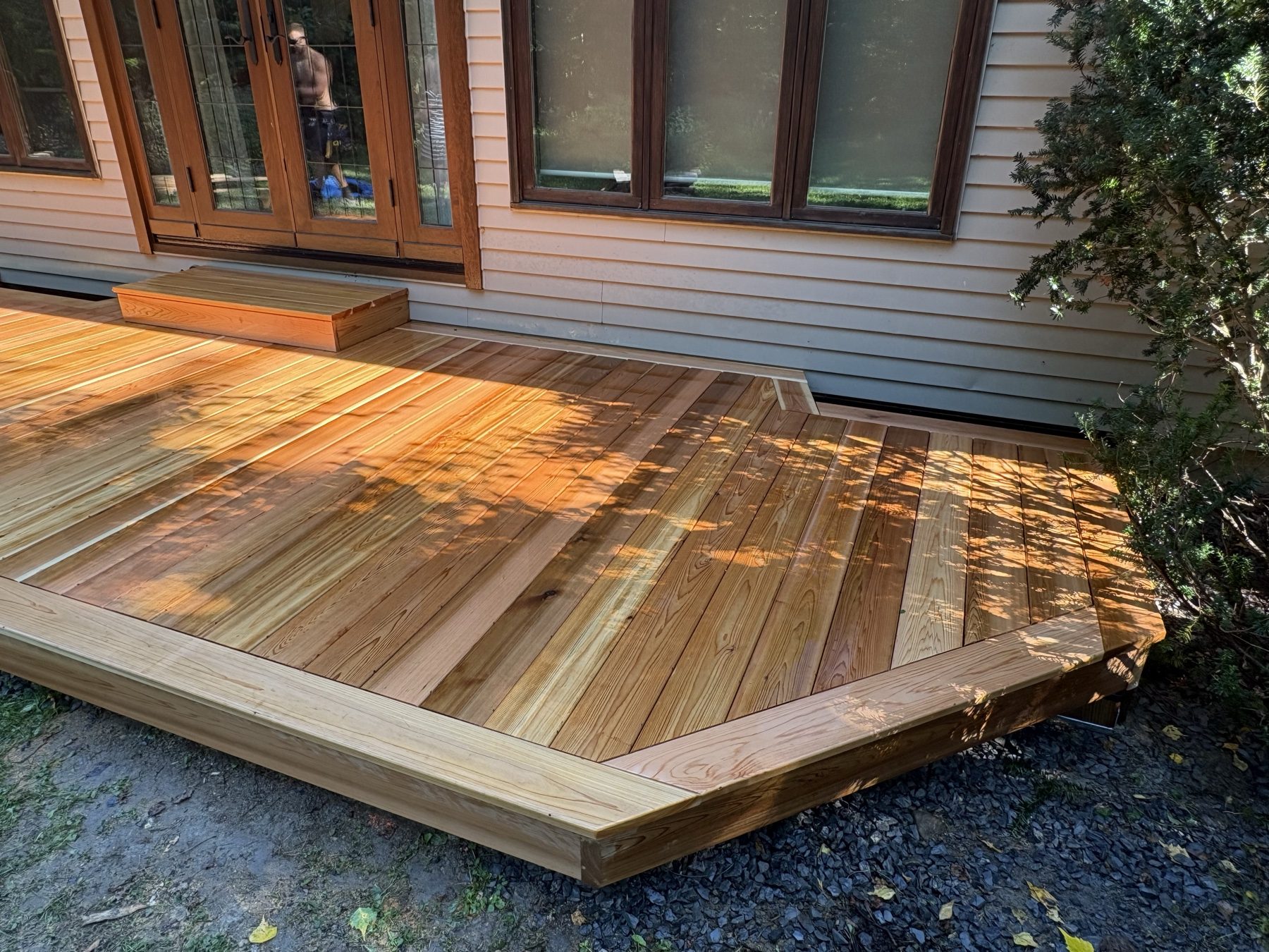 Wood deck at sunset with black railings