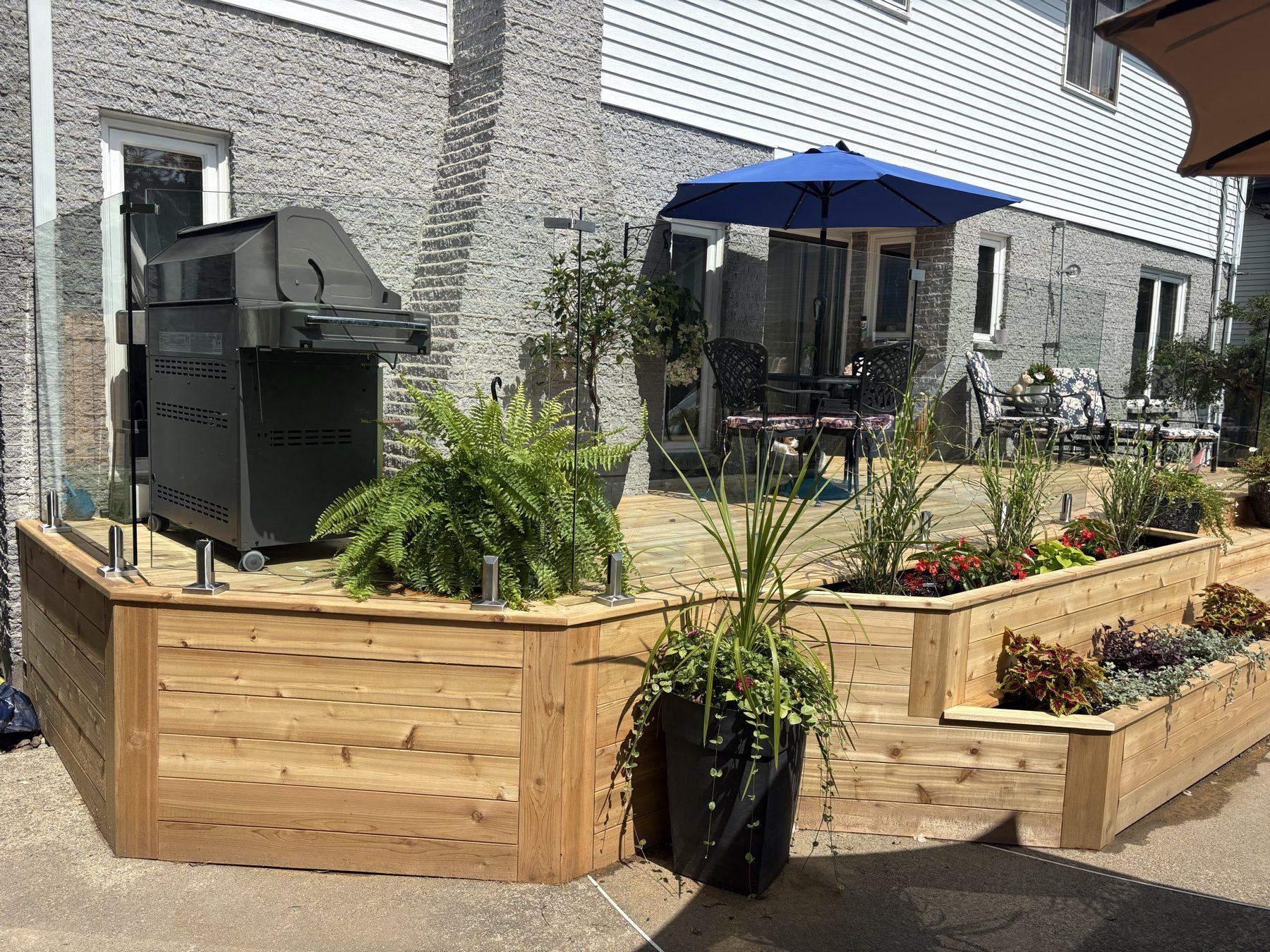 Cedar planters built into a poolside deck