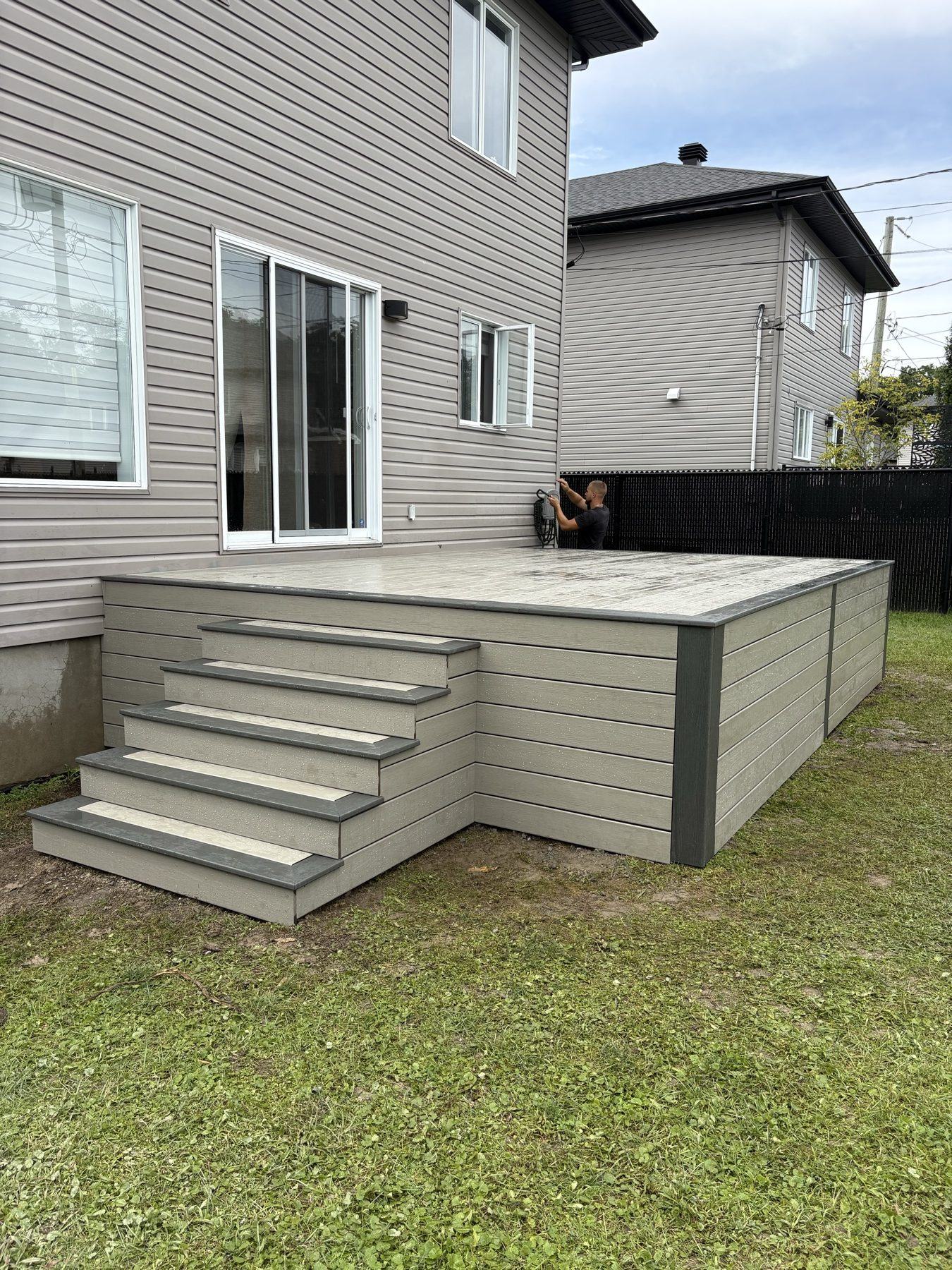Grey composite platform deck with straight stairs